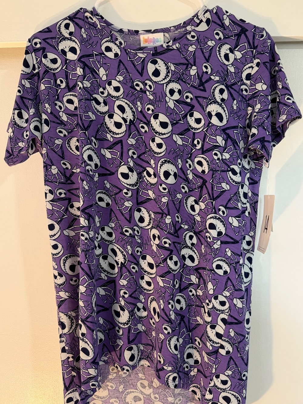 LuLaRoe Purple Short Sleeve Shirt with Black & White Skull Faces